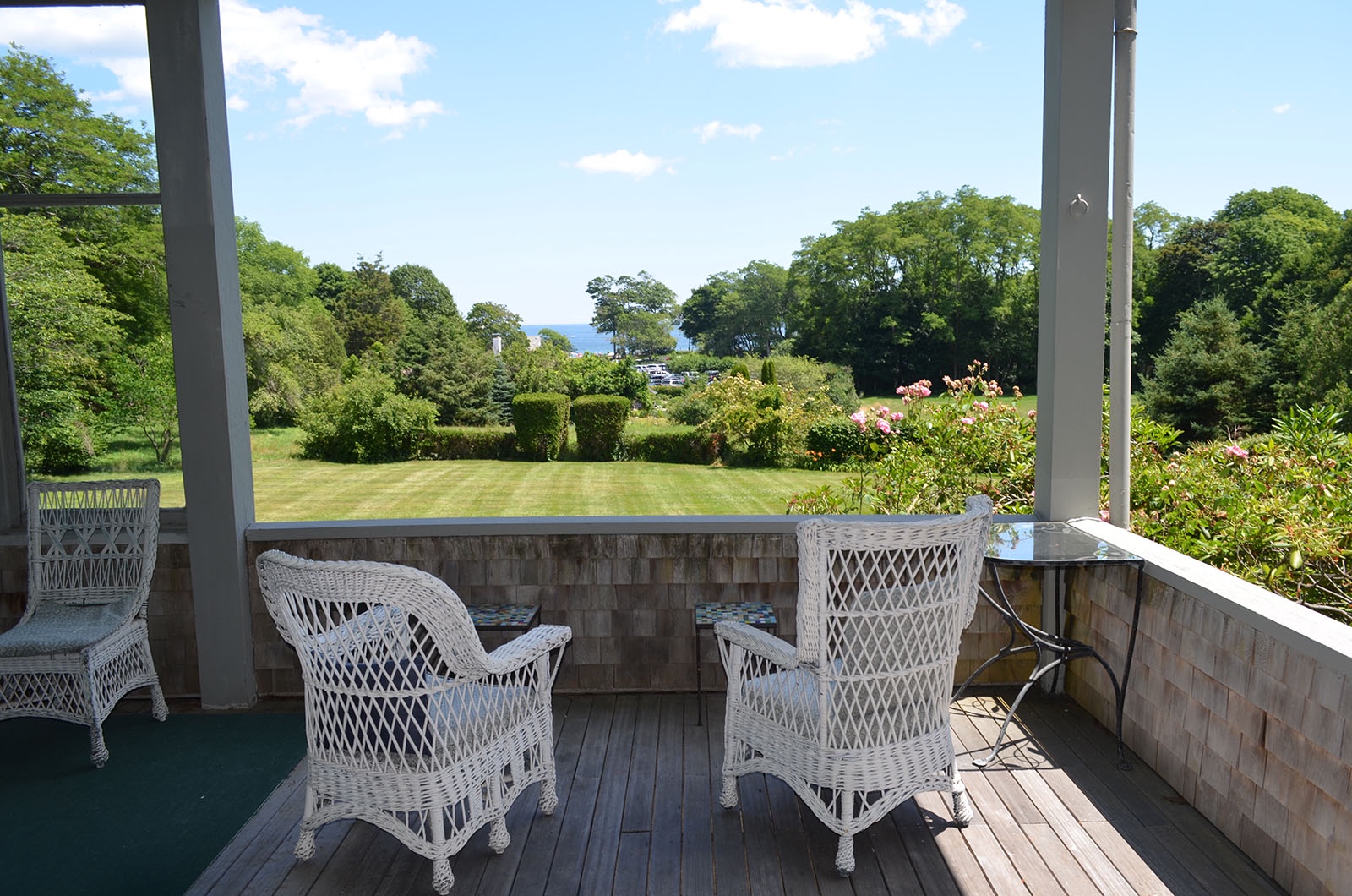 Enjoy a cool breeze and ocean views from the shade of the generous back porch.