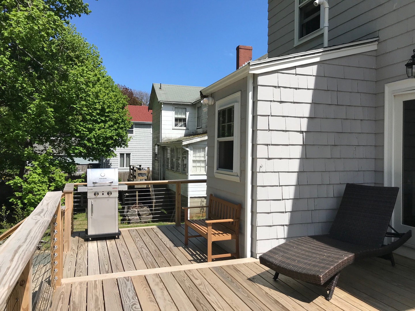 The back deck is perfect for relaxing and outdoor dining.