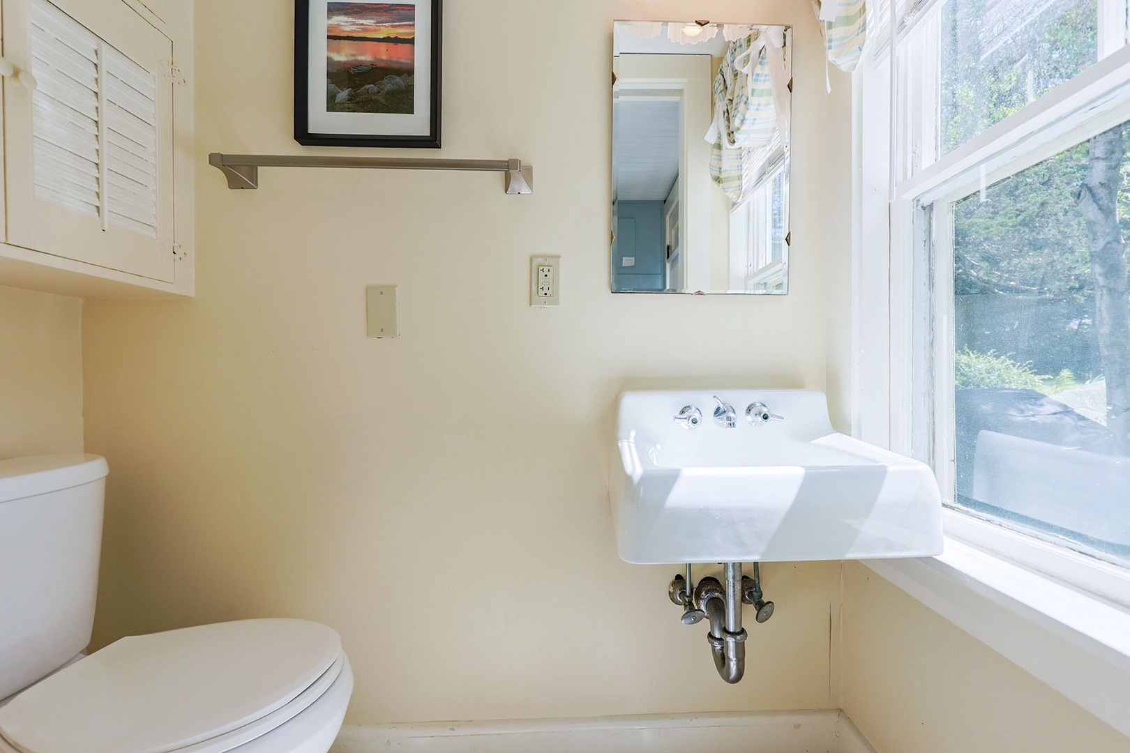 The half-bath/powder room is located just off the kitchen.
