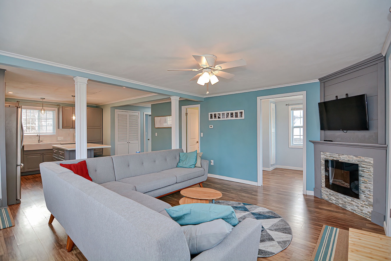 The Living Room has a large sectional sofa and large screen TV.