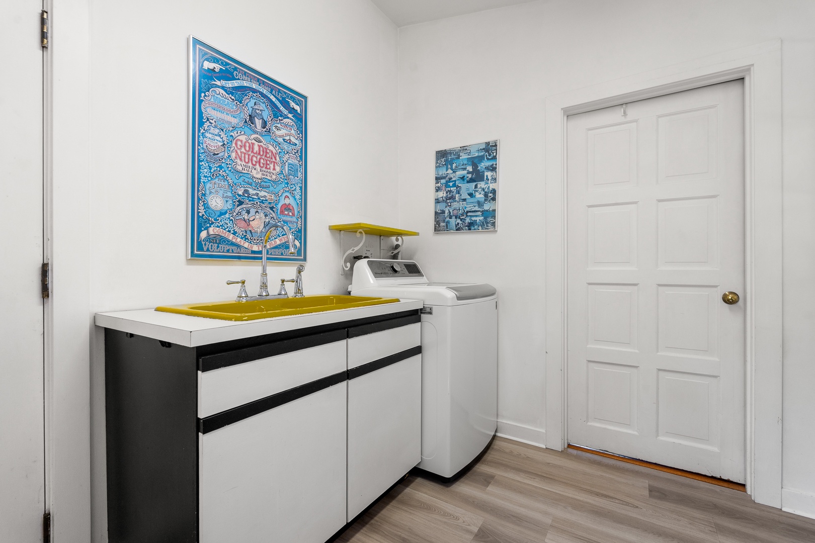 The washer and dryer is located in the room near the entrance to the house.