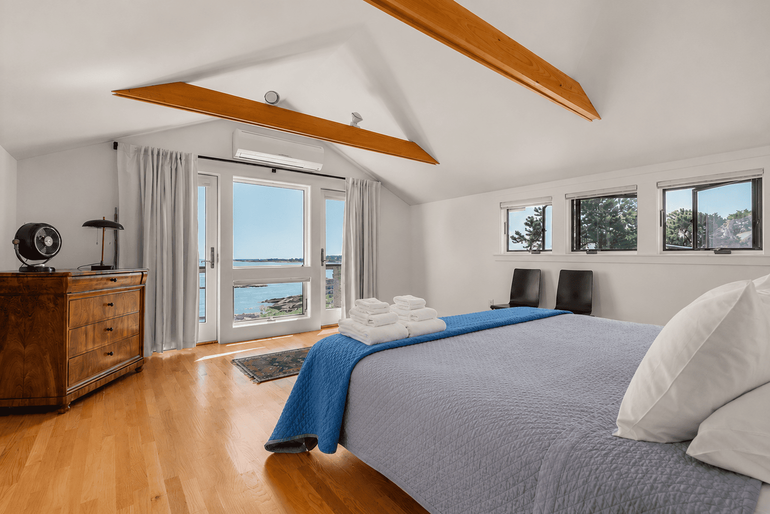 Primary bedroom with a king bed, balcony, and amazing views.