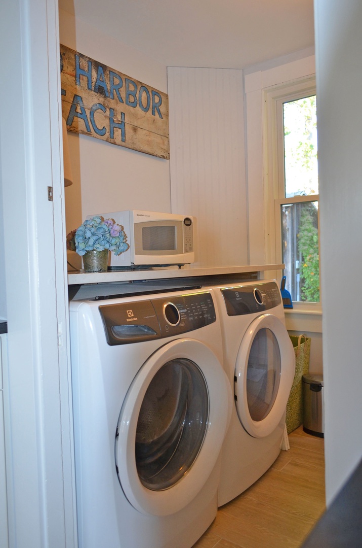The laundry room is just off of the kitchen.