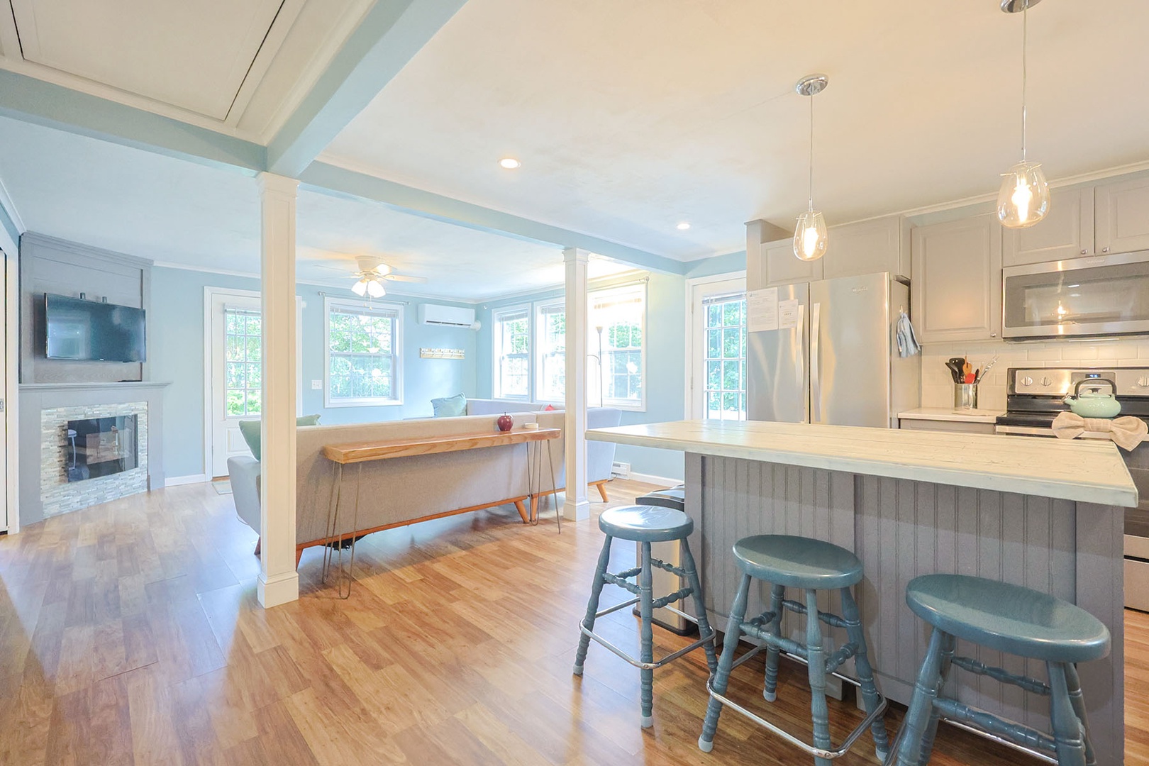 The kitchen island also features seating for three.