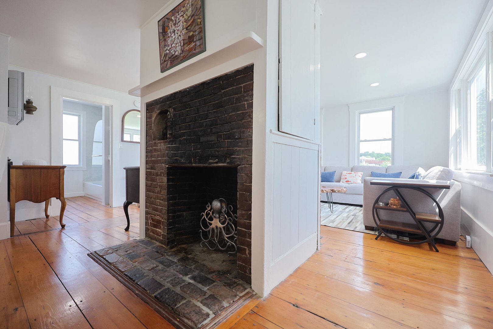The dining room includes an ornamental fireplace.