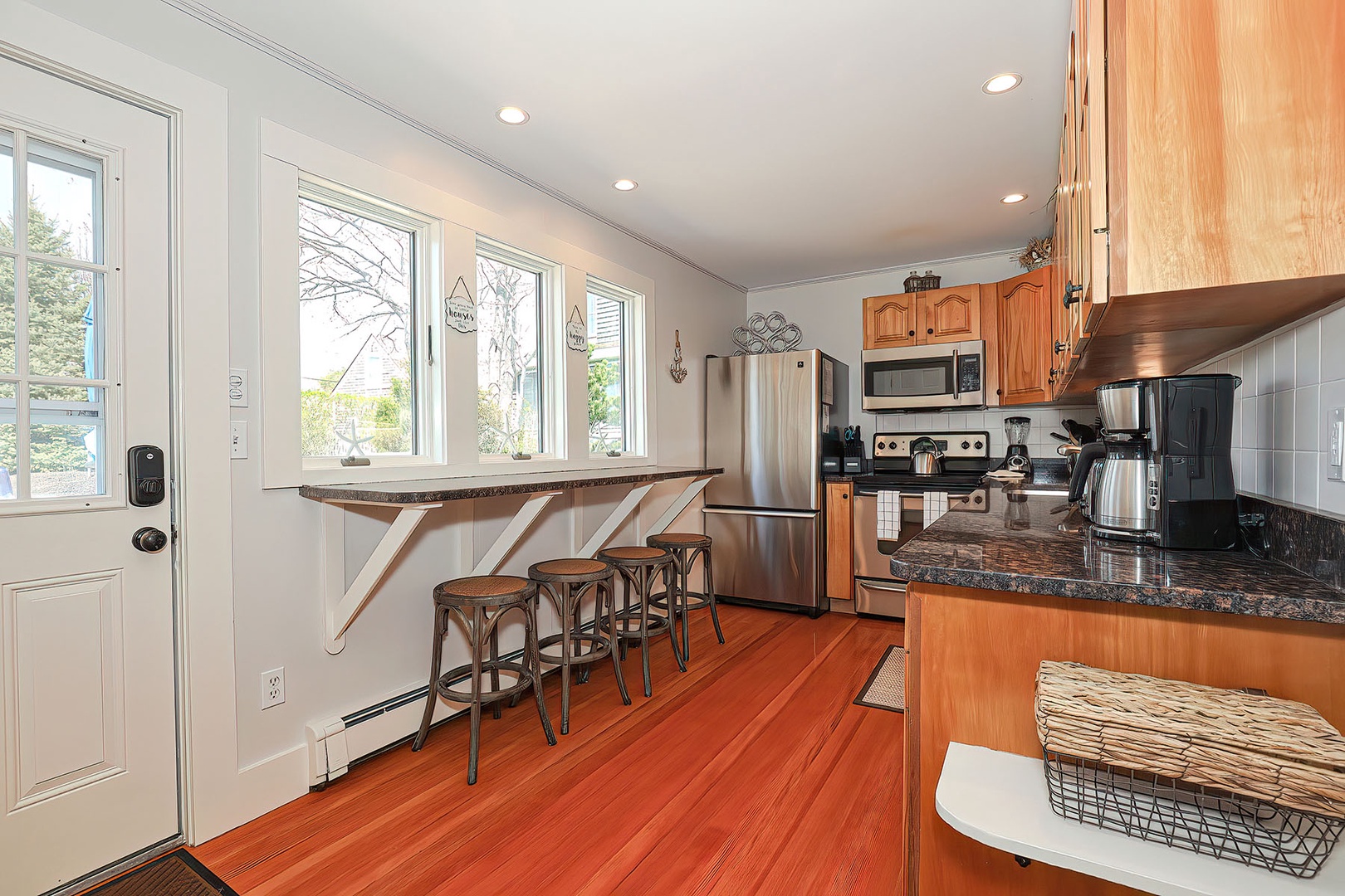 You'll enter into the bright and sunny kitchen.