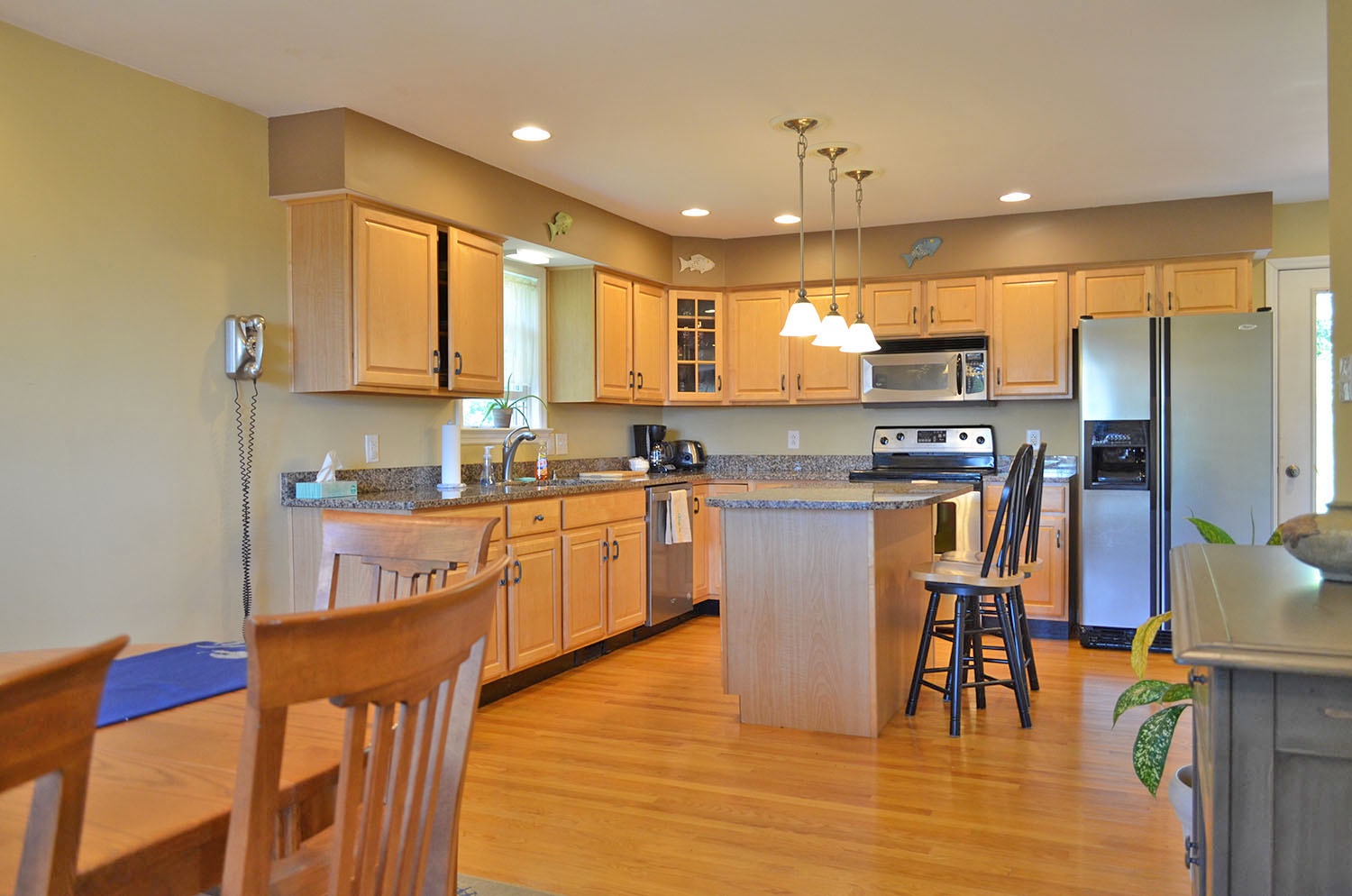 The fully-applianced eat-in kitchen with center island.