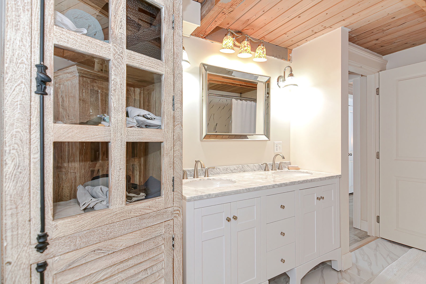 The vanity in the full bathroom.