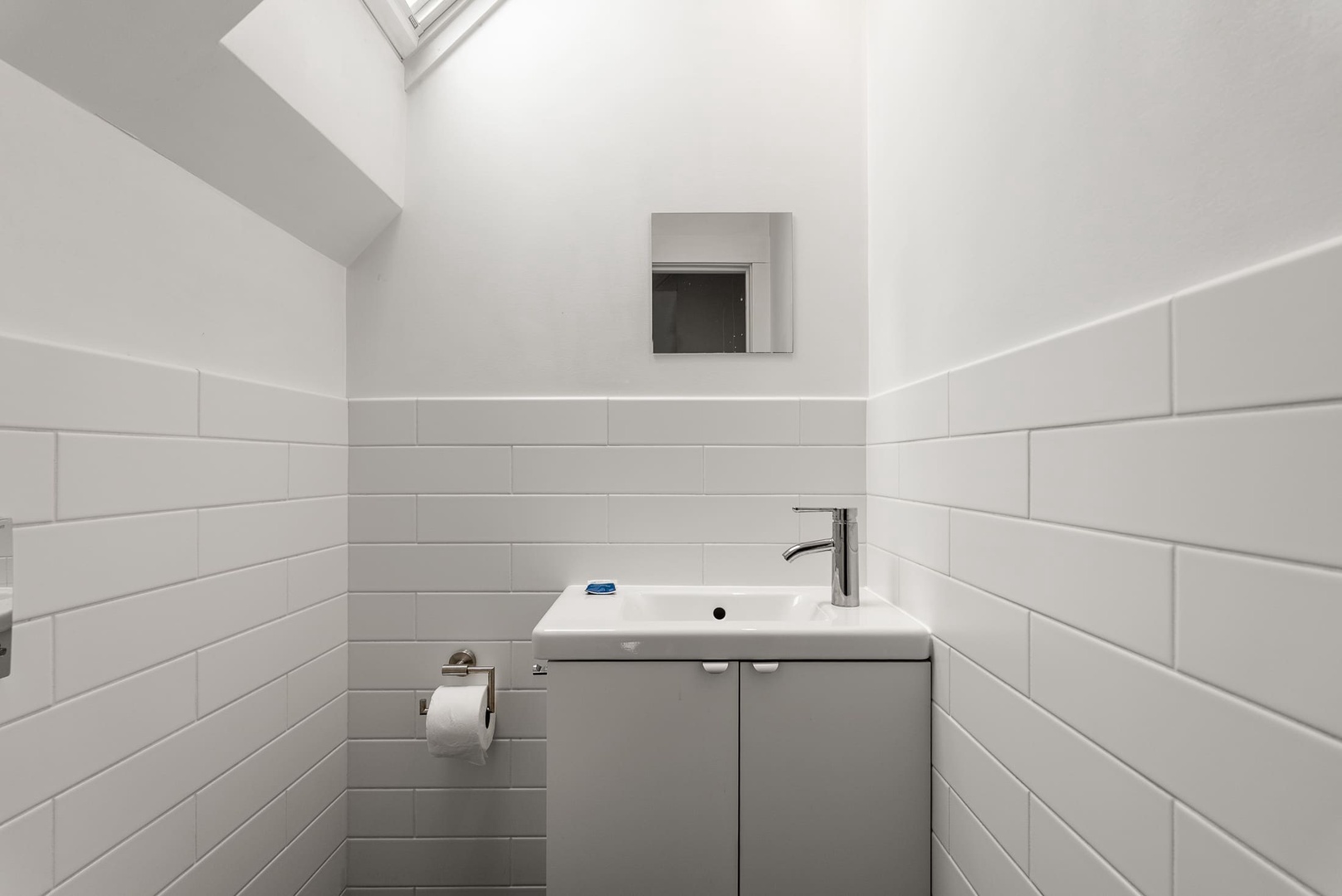The half-bathroom located upstairs.