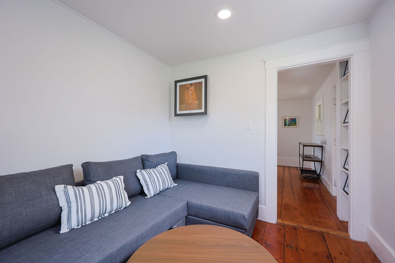 The den with the pull-out sofa is perfect for relaxing during the day or sleeping comfortably at night.