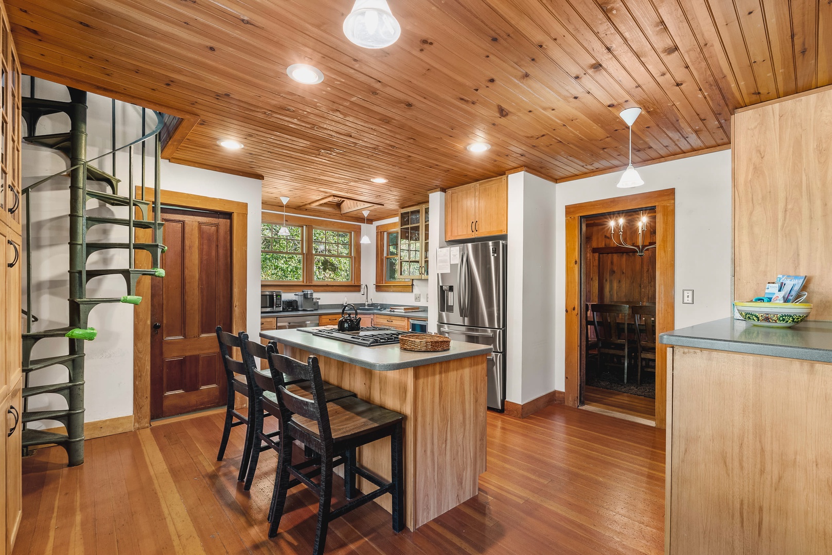 Kitchen features plenty of storage and a dining nook.