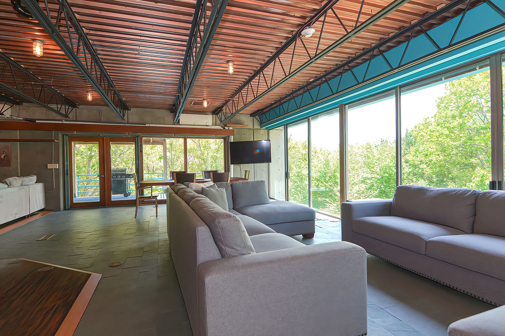 Take in the wooded view from the enormous windows on two sides.