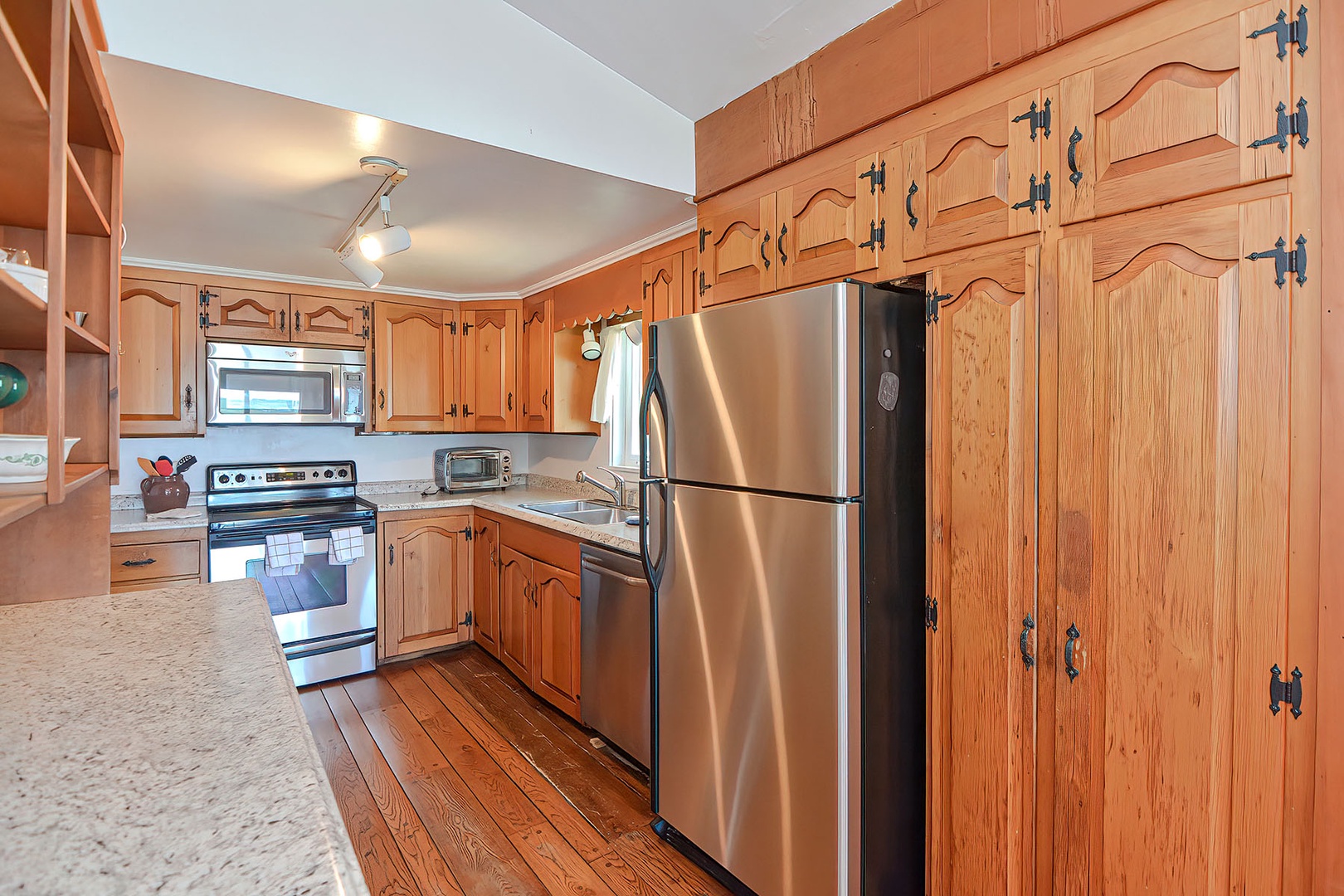 The kitchen has updated stainless appliances.