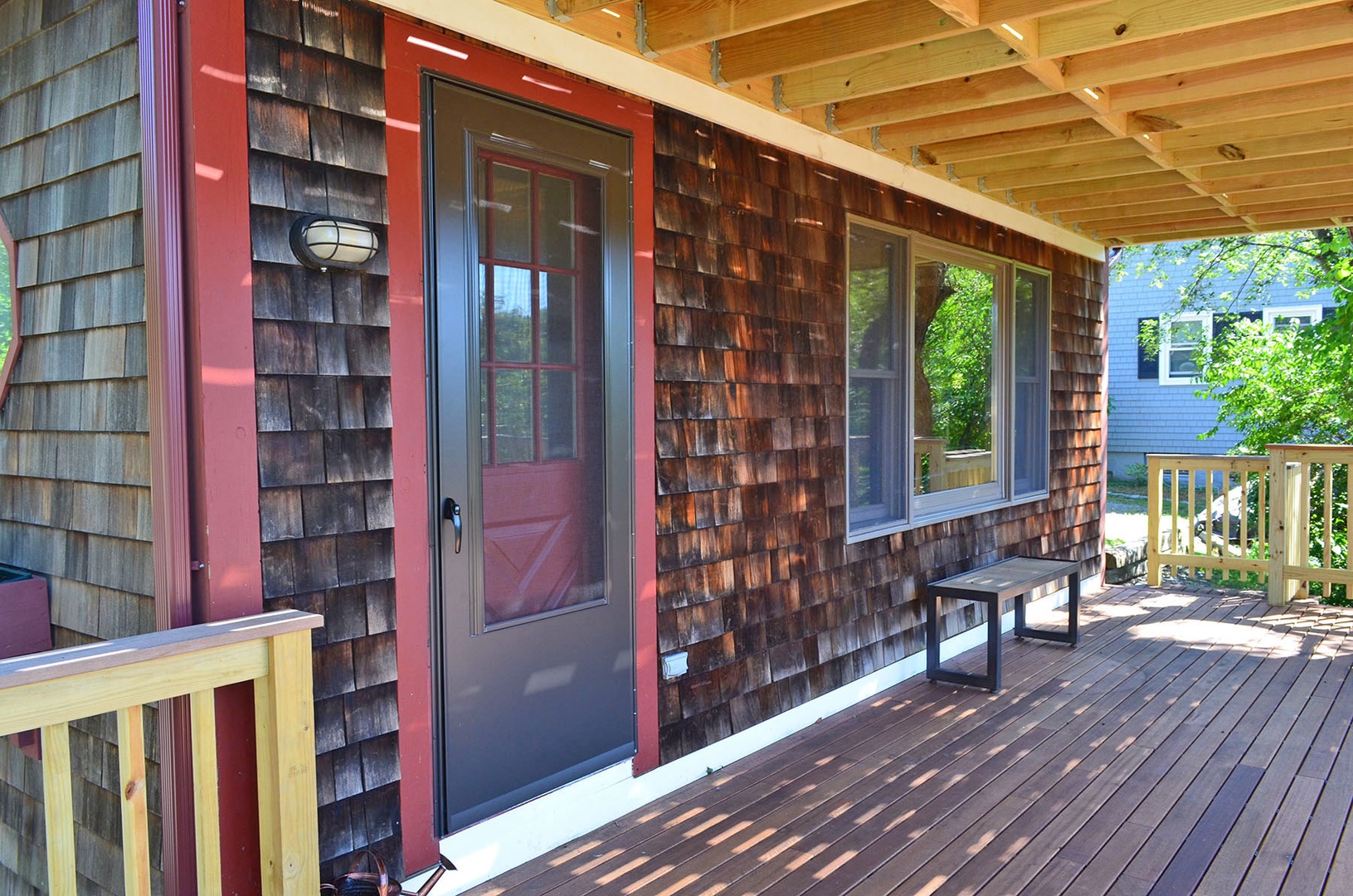 The main door to the home is accessed from the deck.