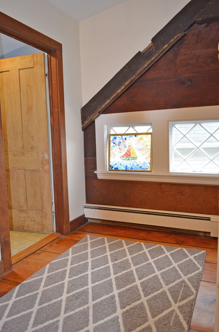 The second floor landing and door to the full bath upstairs.