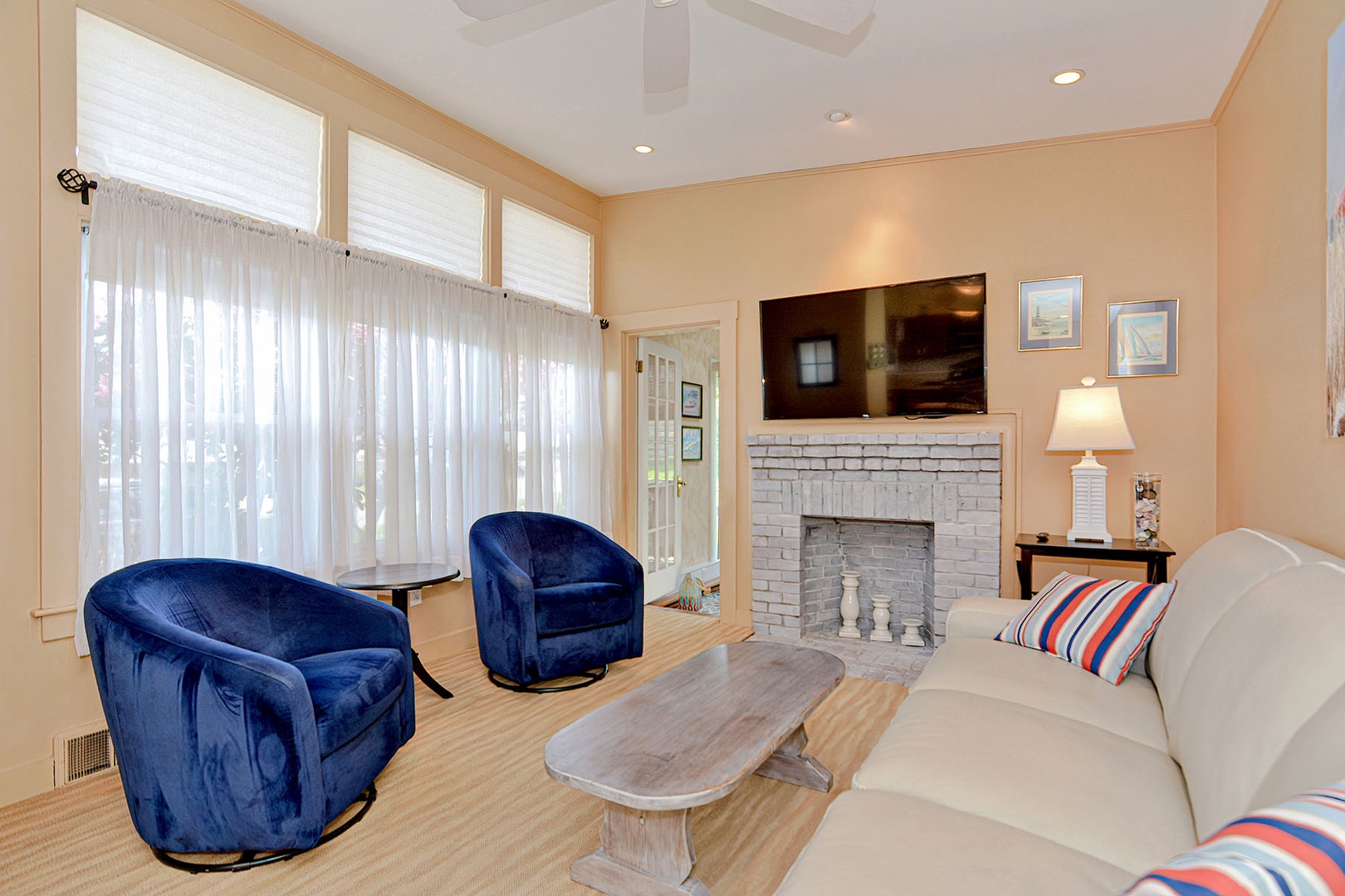 Living room includes a 55” flat screen TV.