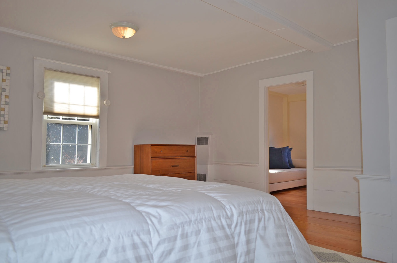 Access the bright corner sitting room through the Primary bedroom