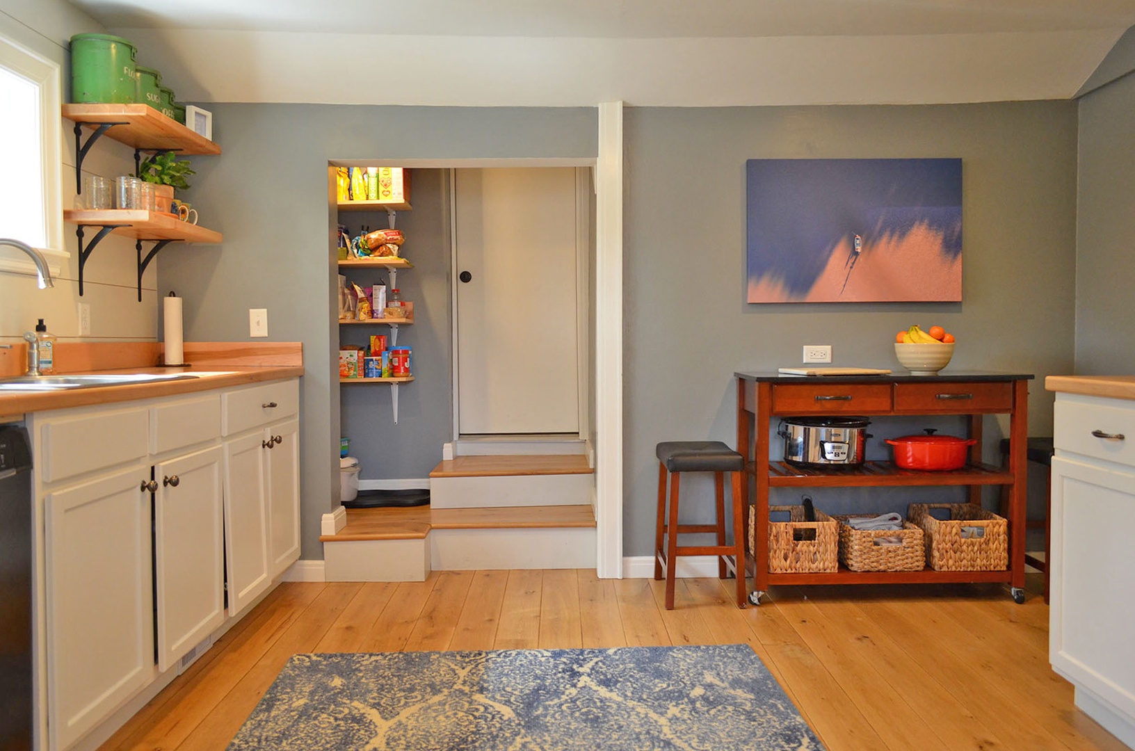 Enter the home into the contemporary kitchen.