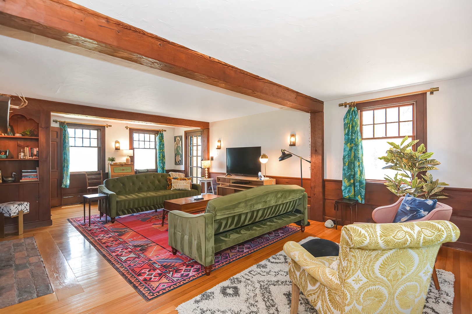 The living room offers several seating areas.