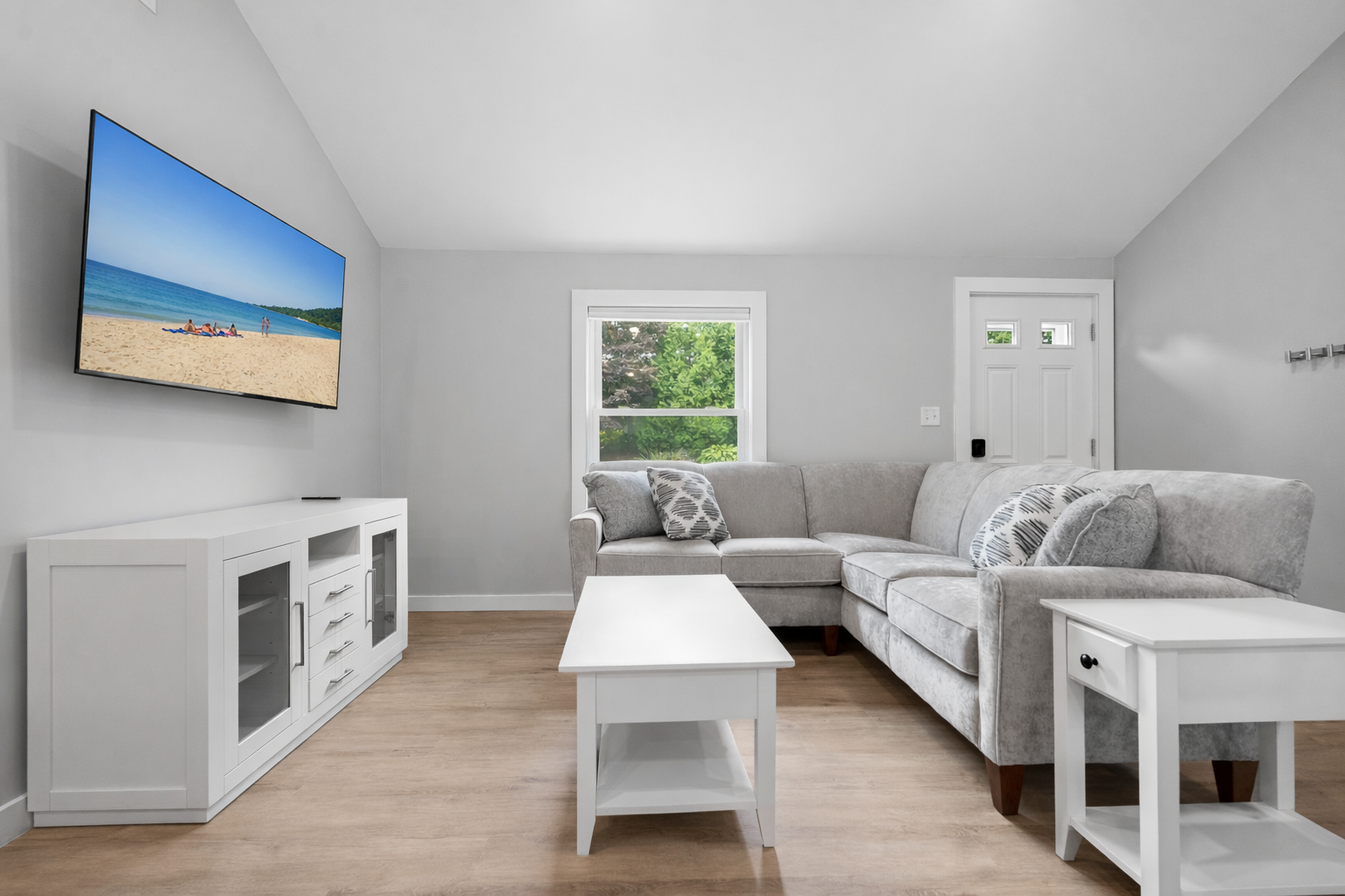 Spacious and cozy living room with a TV.