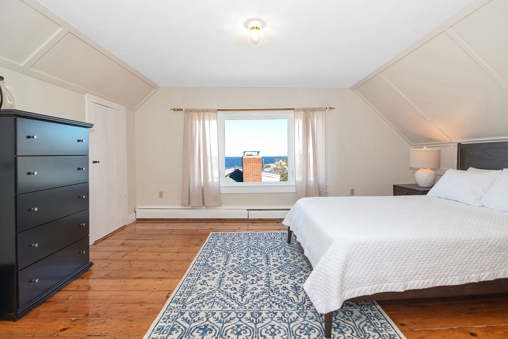 Primary Queen bedroom on the 3rd level, with ocean views.
