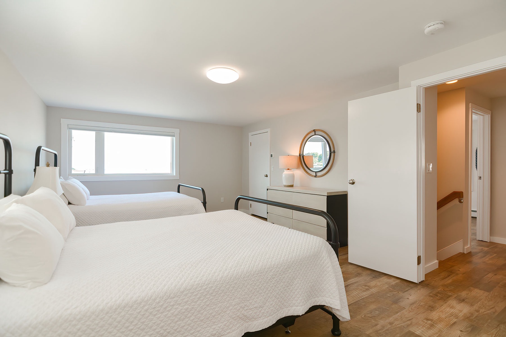 Double queen bedroom with water view.