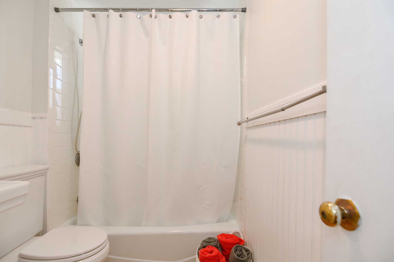 Full bath with shower over tub.