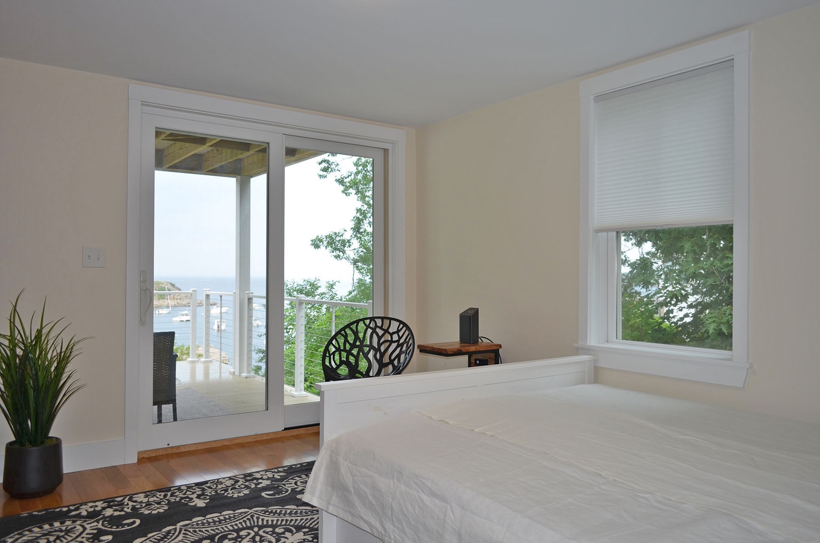 The bedroom with sliders accessing the back deck.