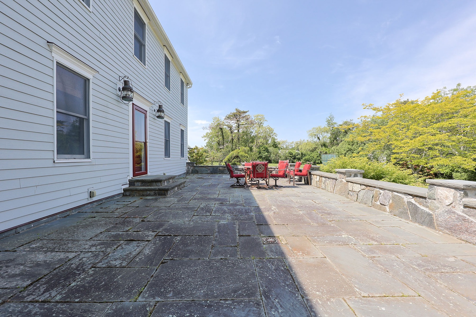 Large slate patio at the front of the home.