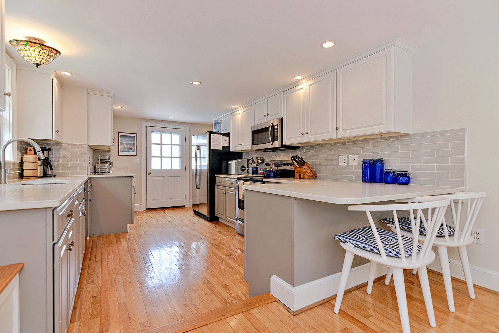 The kitchen with a breakfast bar.