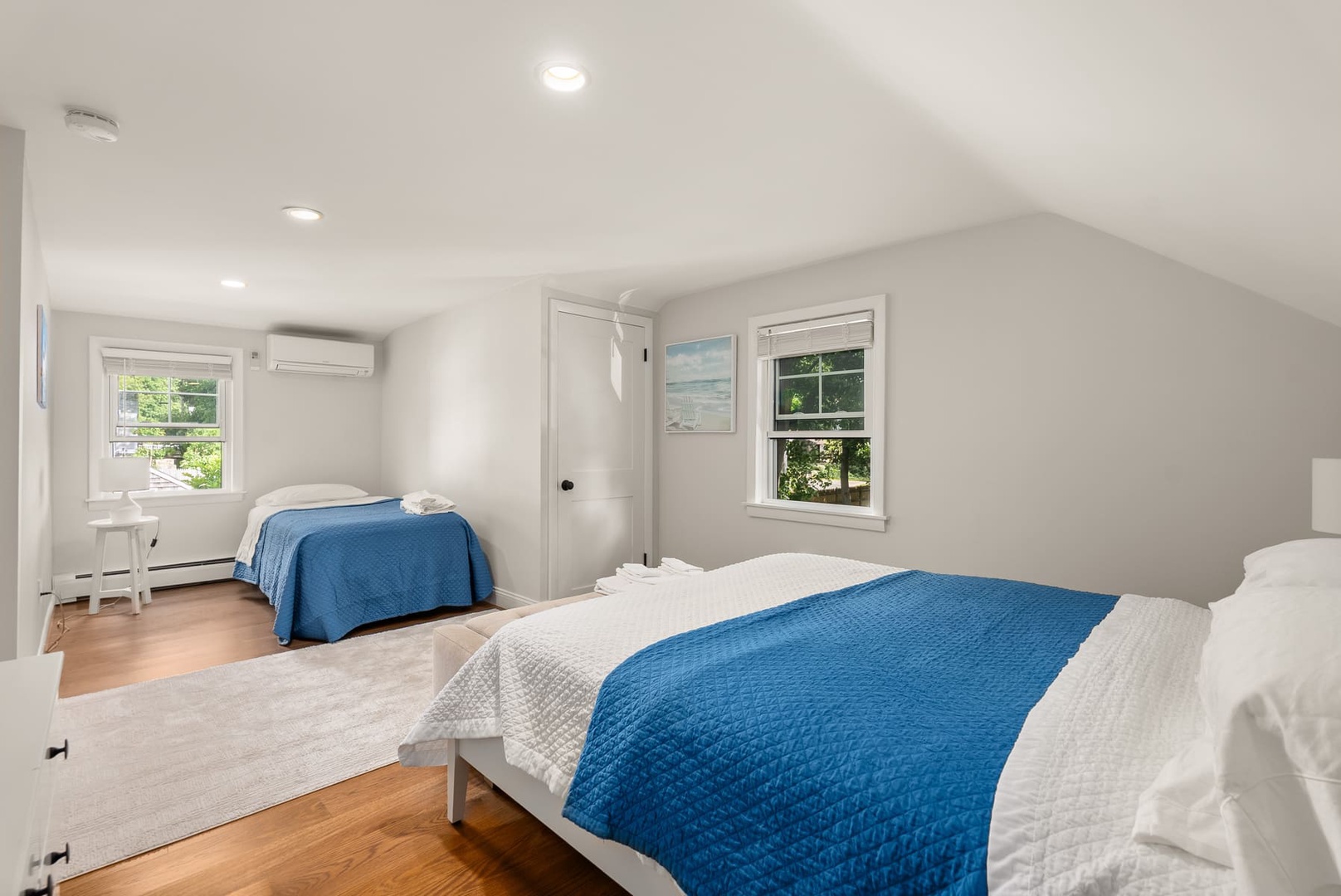 Third bedroom with a full bed and a single twin bed, upstairs.