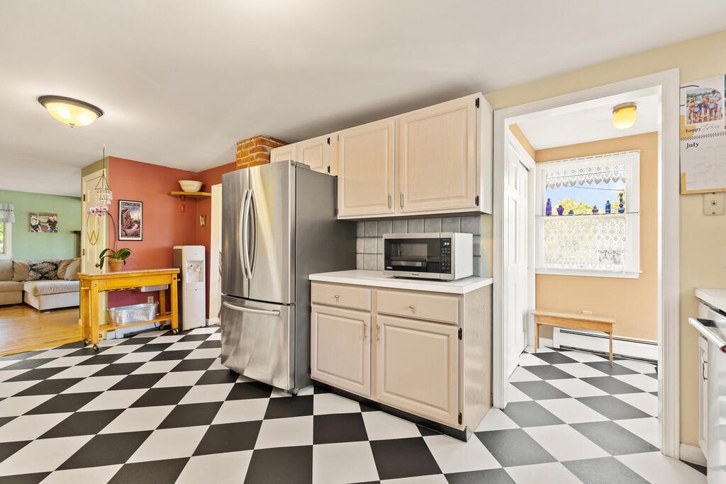 There is a side entrance and hallway closet off the kitchen.