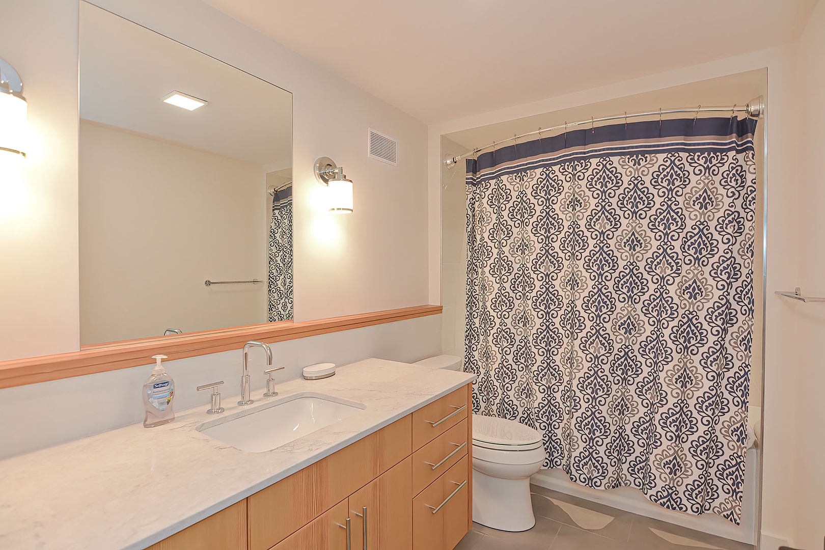 A full bath with a tub/shower combo is located on the lower level.