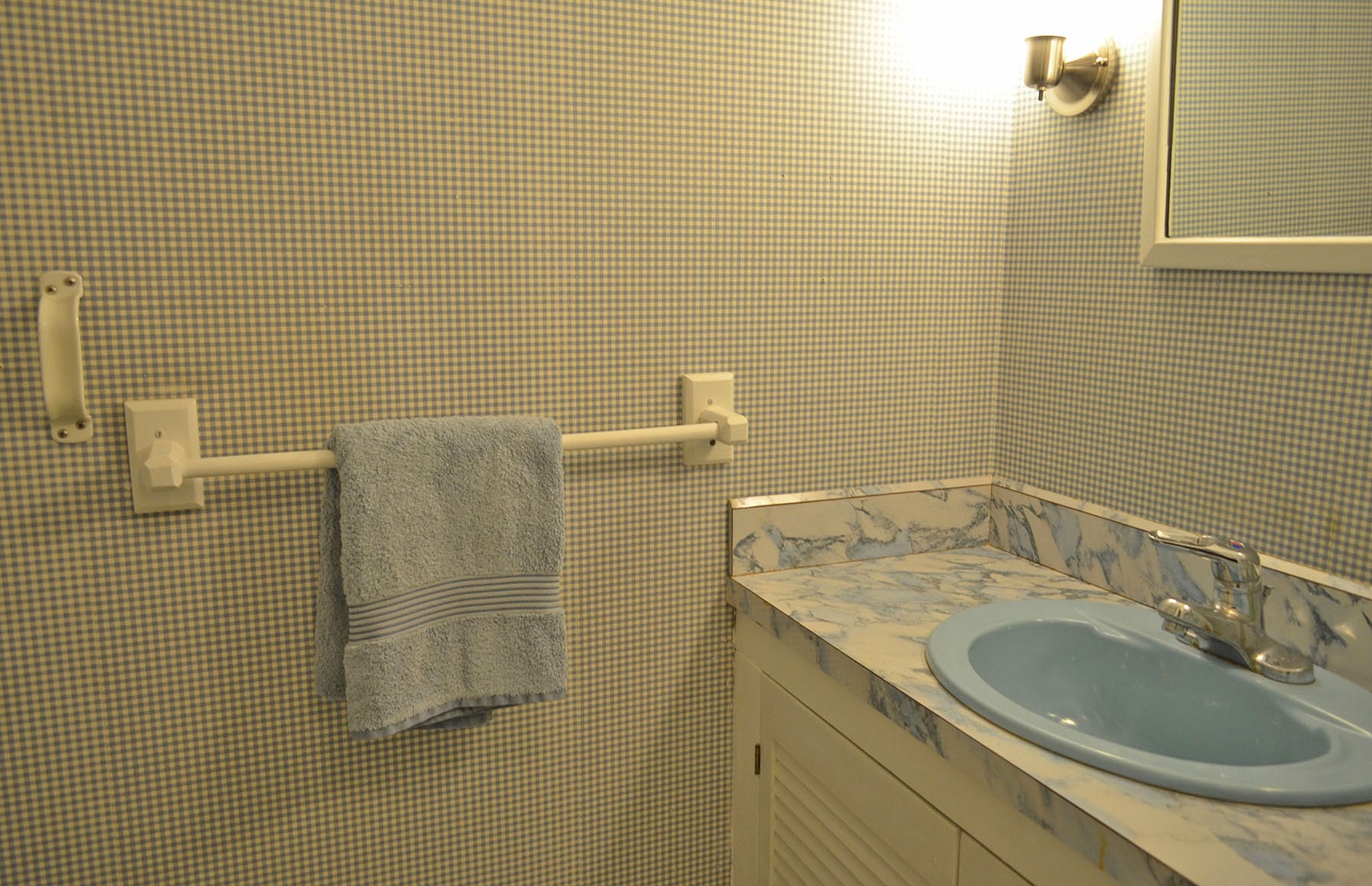 View of the separate bathroom adjacent to the walk-in shower.