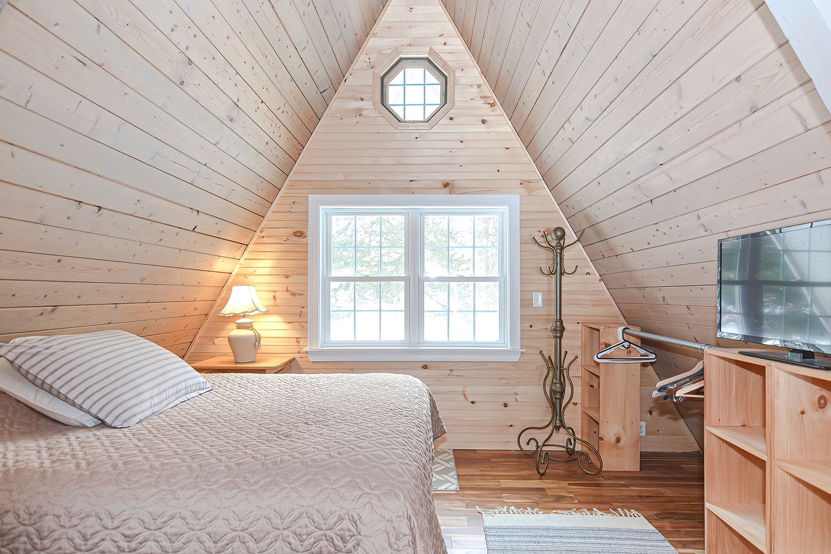 The bedroom has a Queen bed.