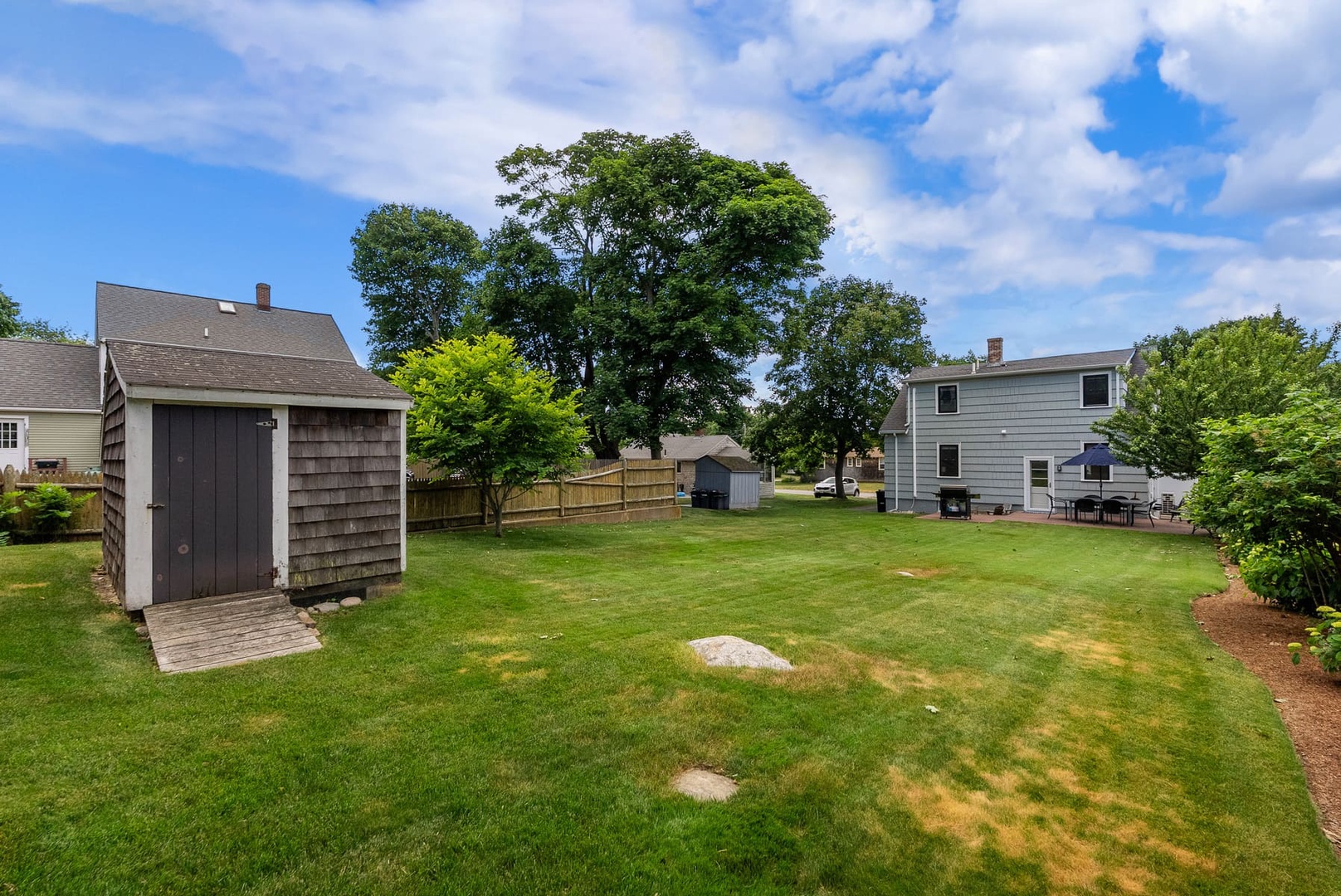 The large backyard of the house.