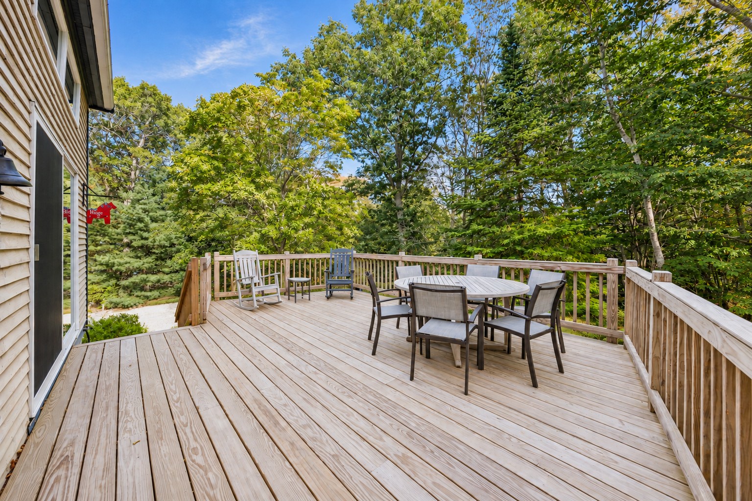 The beautiful deck, surrounded by trees, fresh air, and the peaceful sounds of nature.
