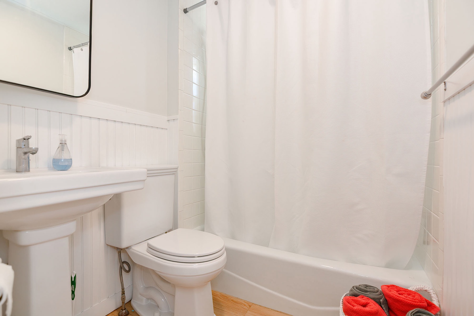 Full bath with shower over tub.