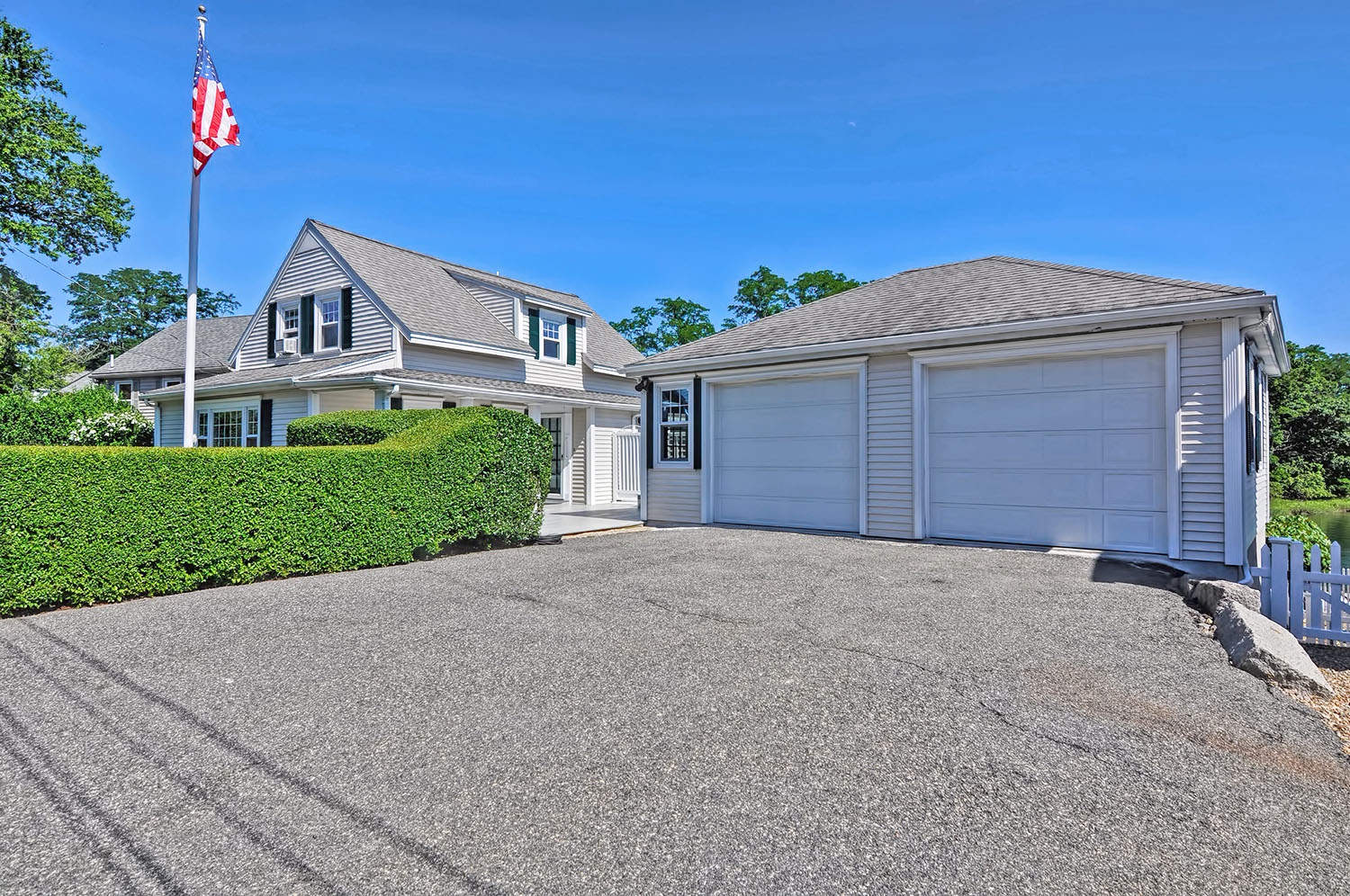 The house, driveway, and garage.