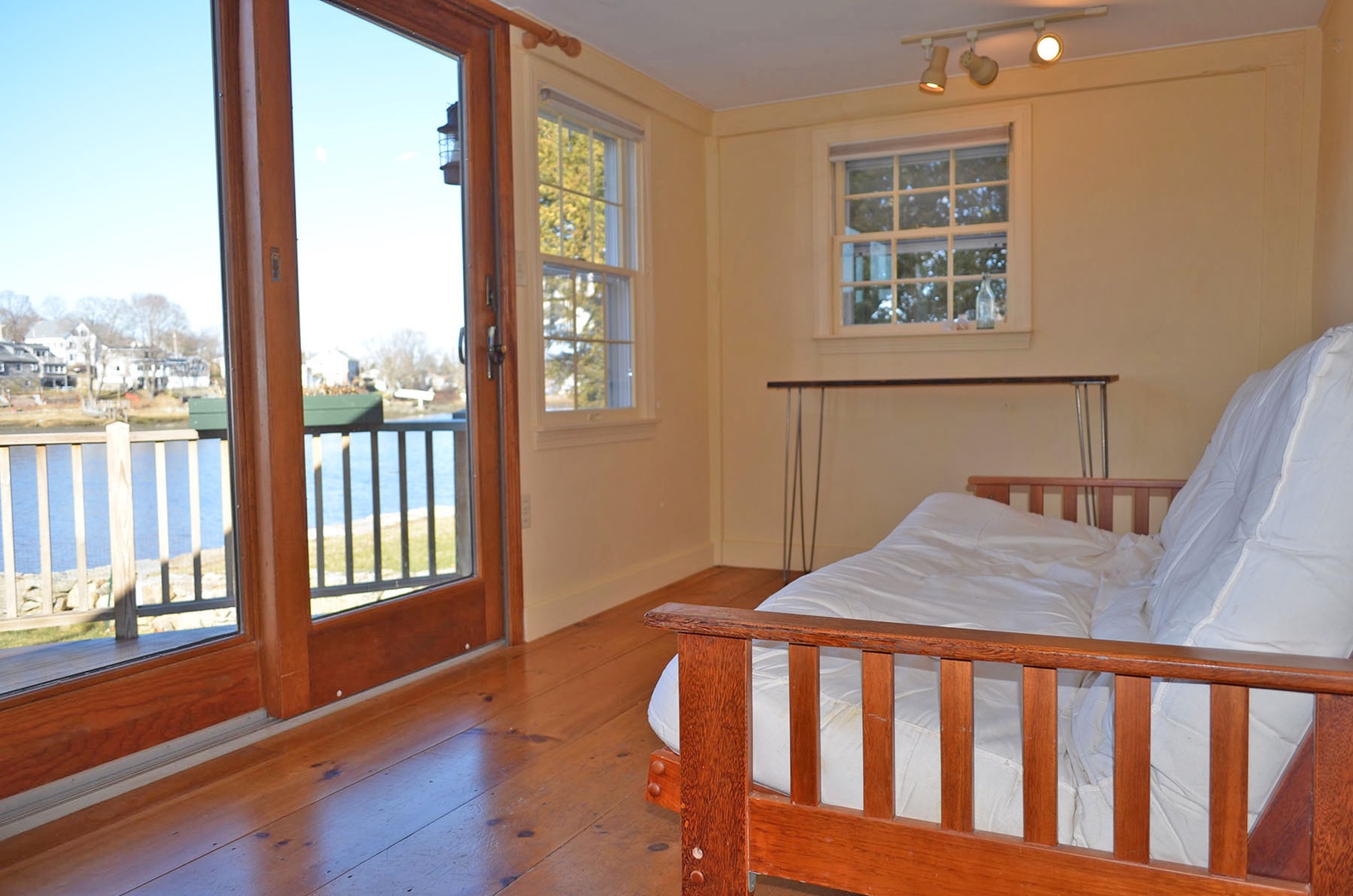 Relax in the den looking out to the exquisite river views.