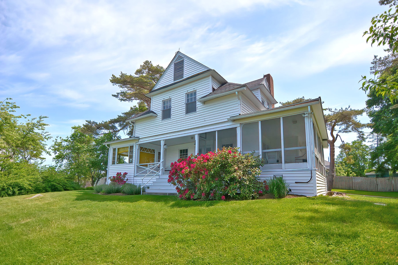 View of the back of the house, open and enclosed porches.