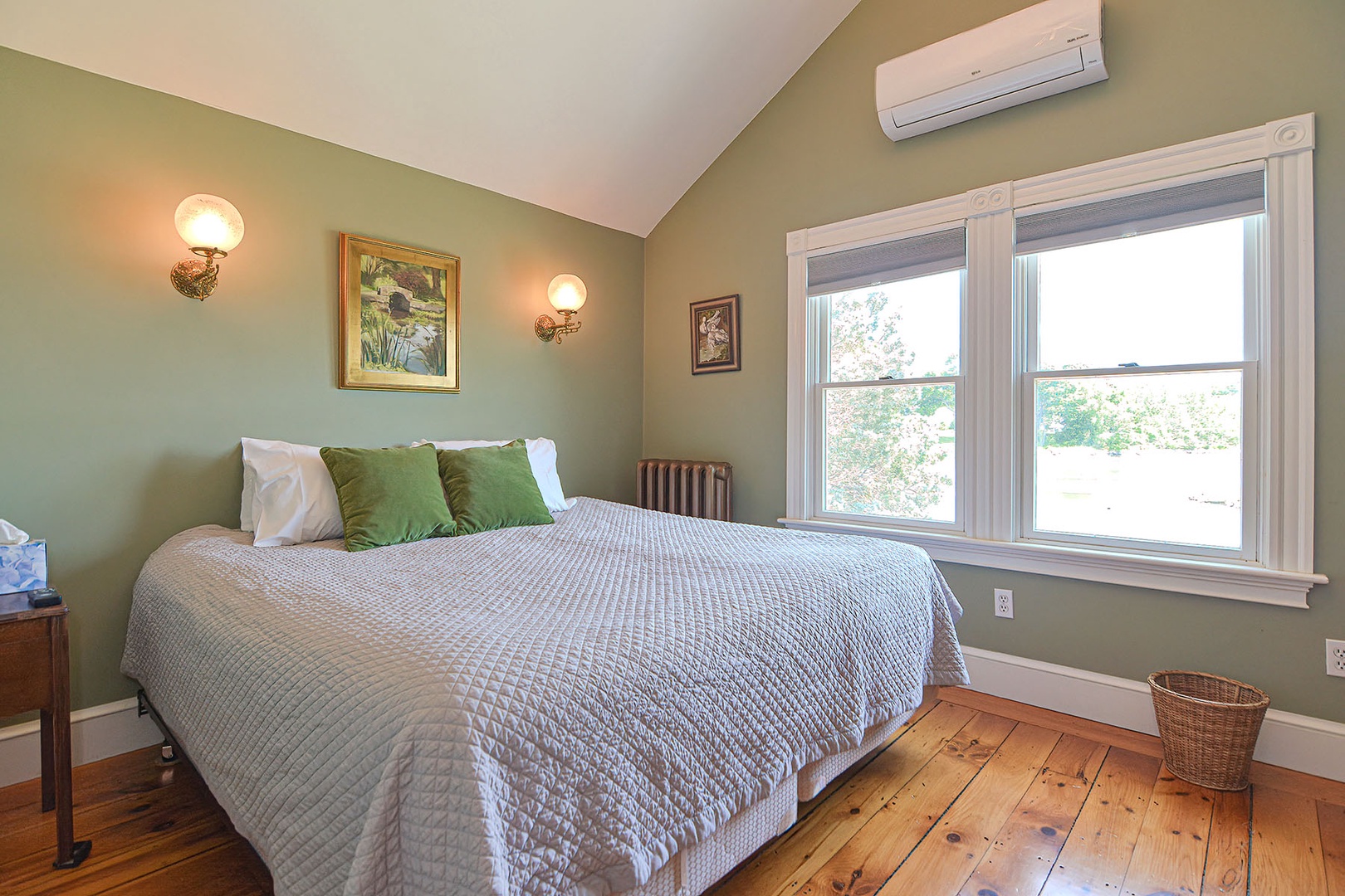 King bedroom with pond view and AC split