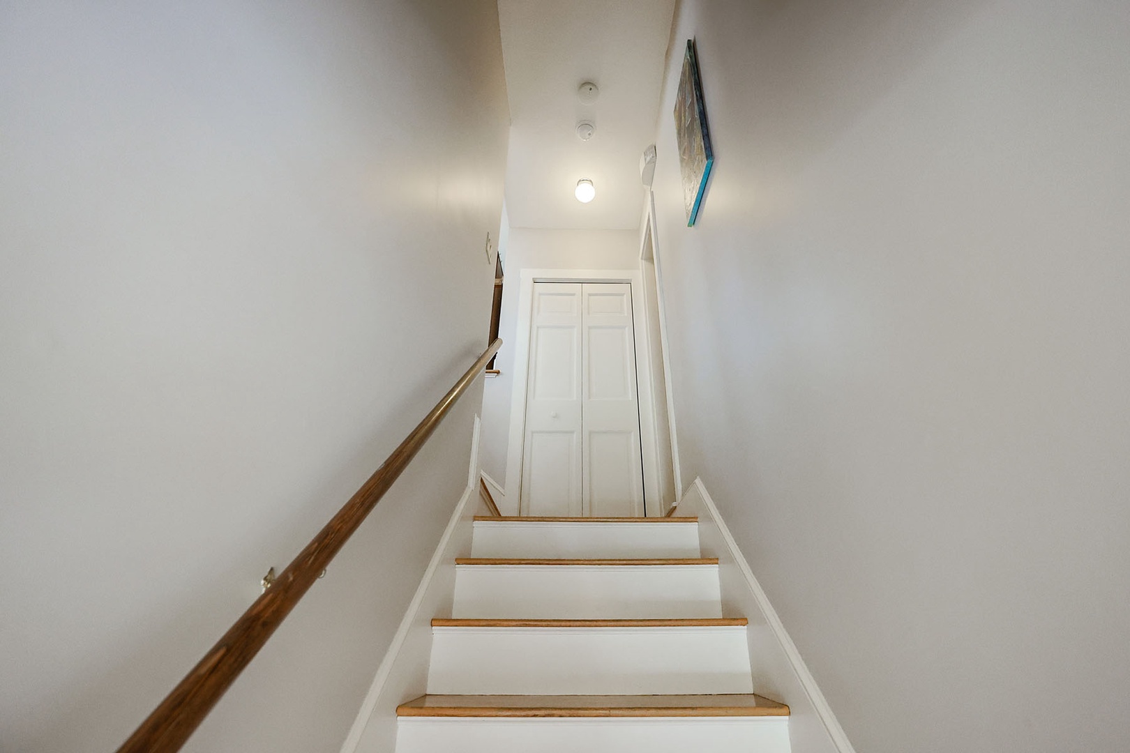 Stairs from main hallway leading to the in-law / au pair suite.