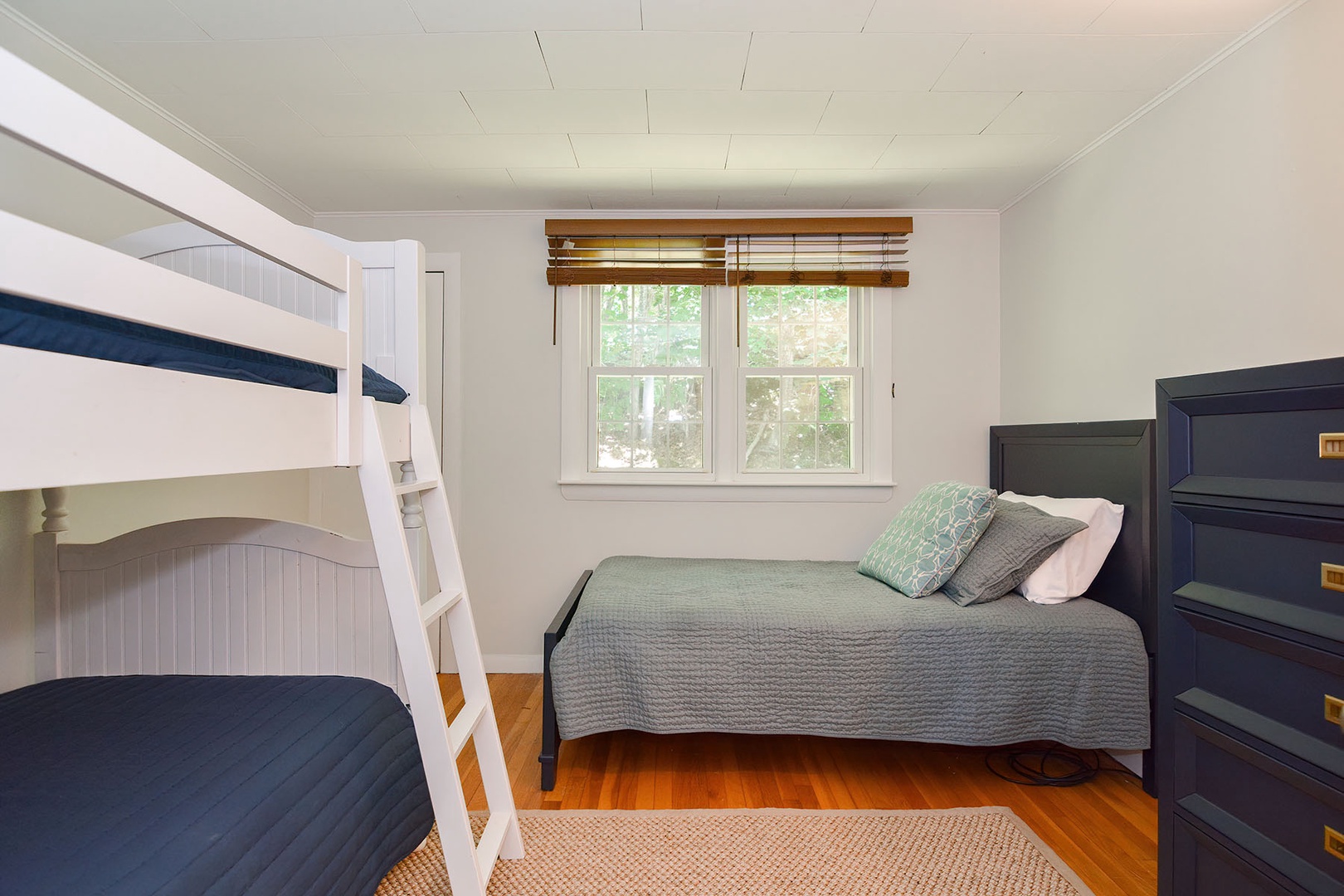 Bunk room with three twins.