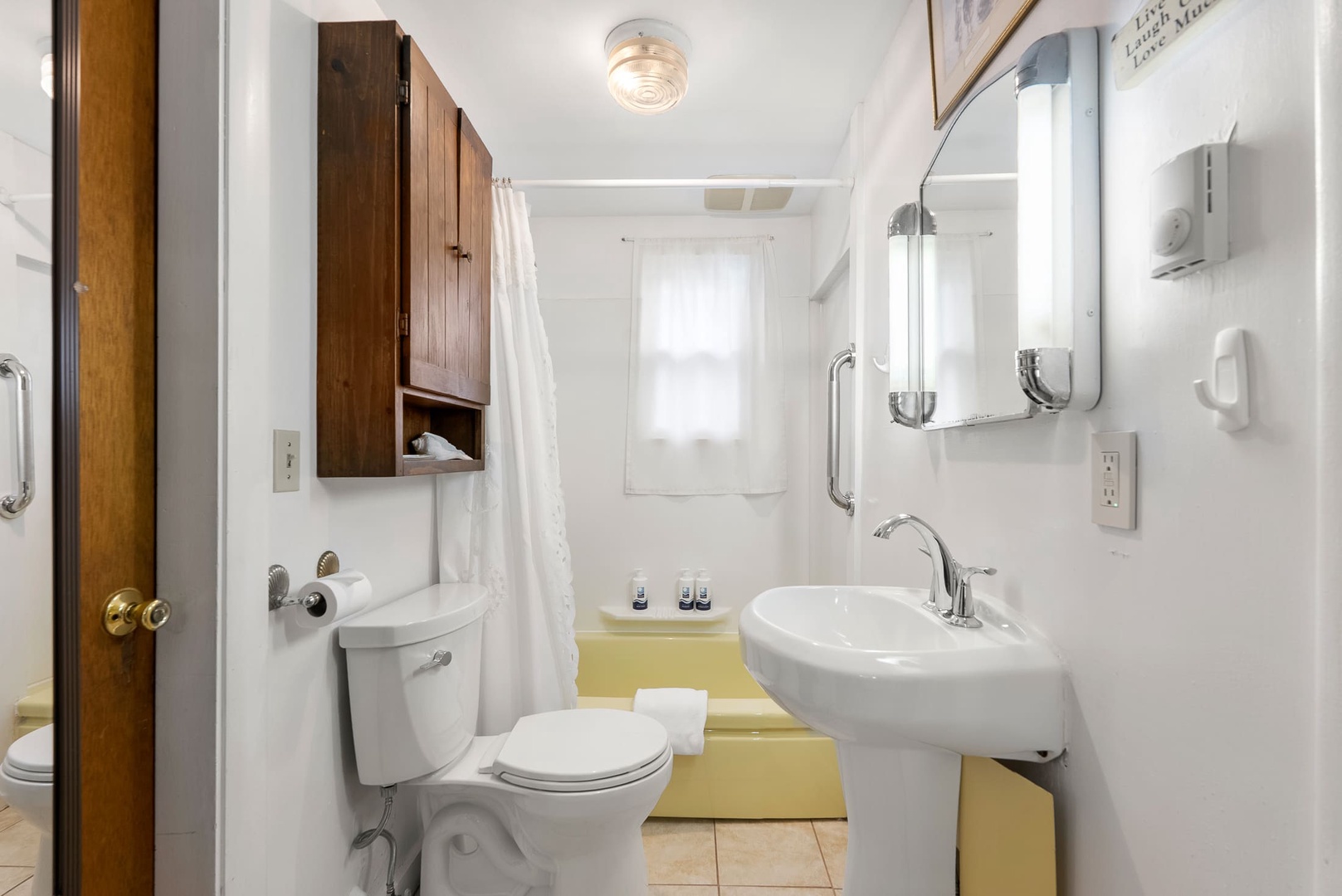 Full bathroom with tub/shower combo.