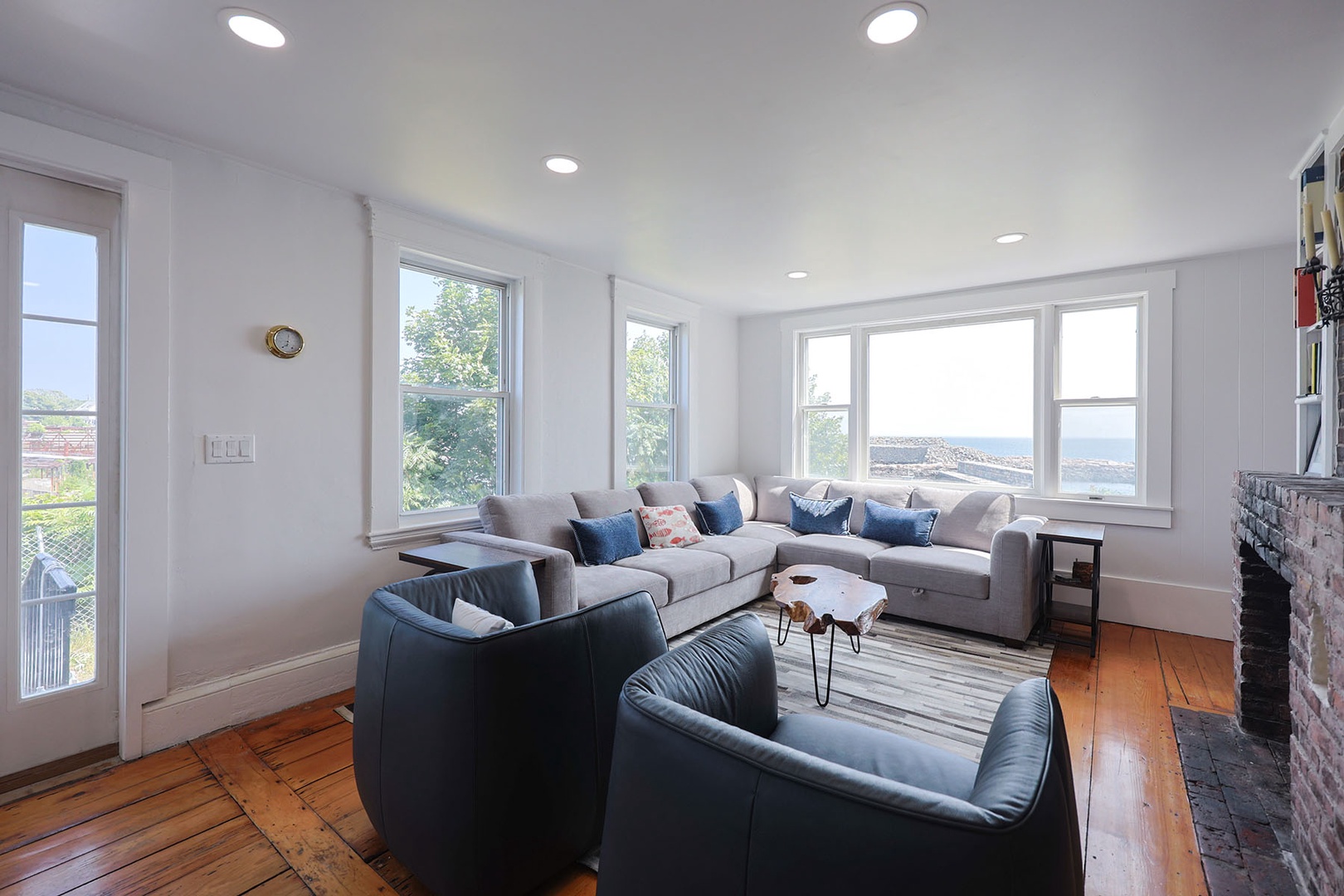 The living room has lovely views of Pigeon Cove.