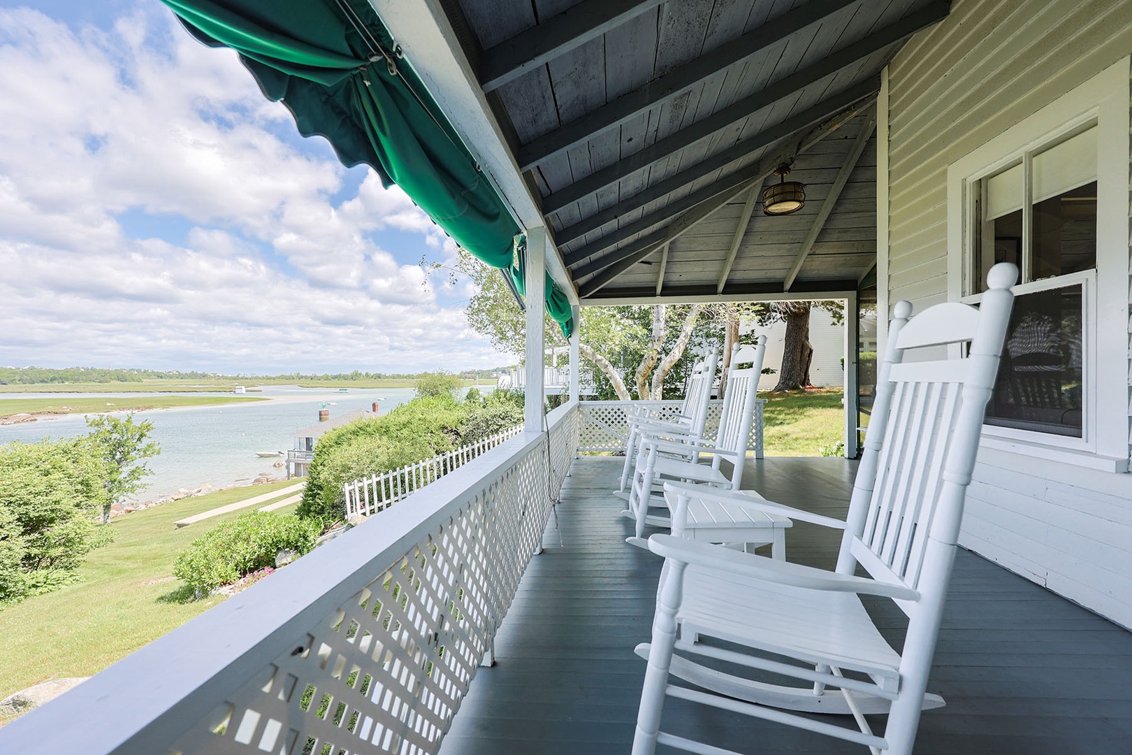 The back porch is perfect to relax and unwind with the rocking chairs.
