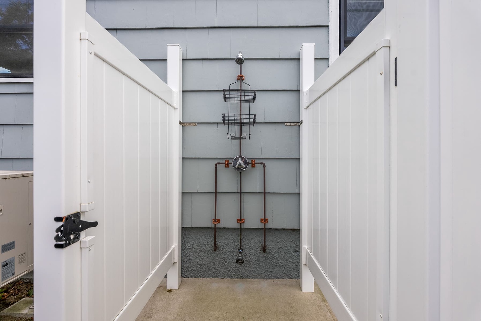 The outdoor shower in the backyard.