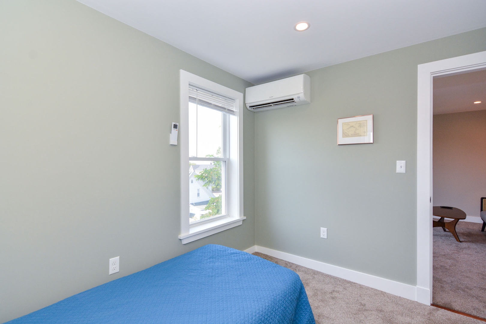 The second bedroom has peekaboo views of the ocean out the windows.