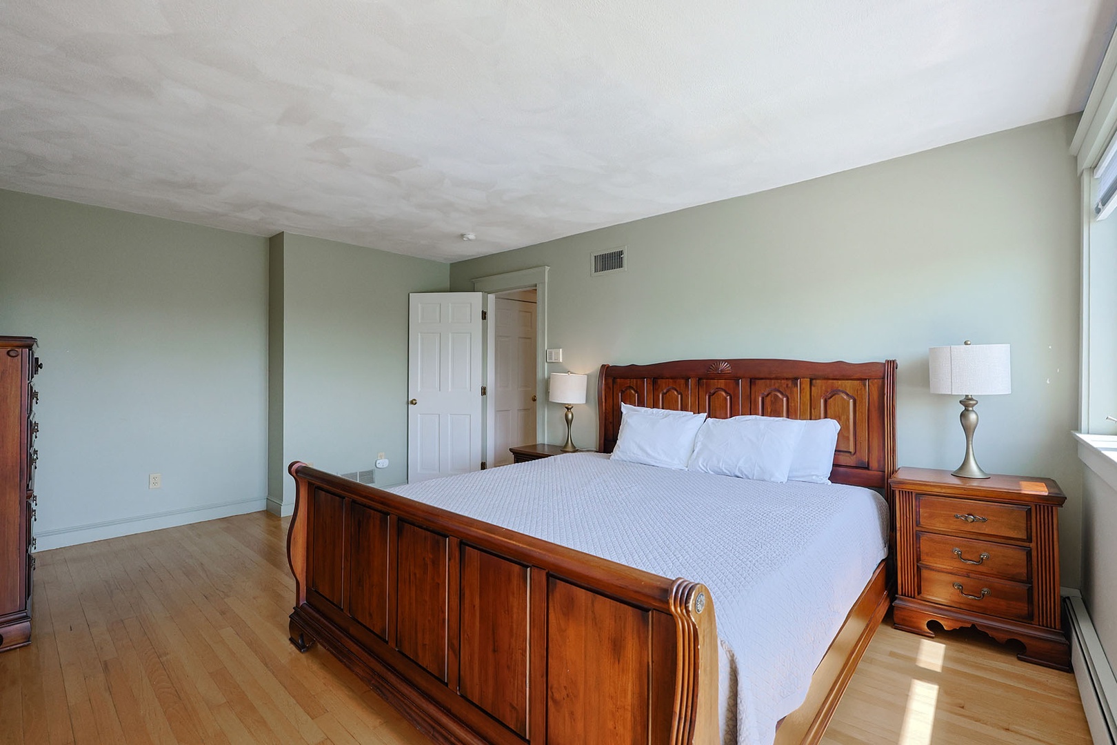 Another view of the primary bedroom.